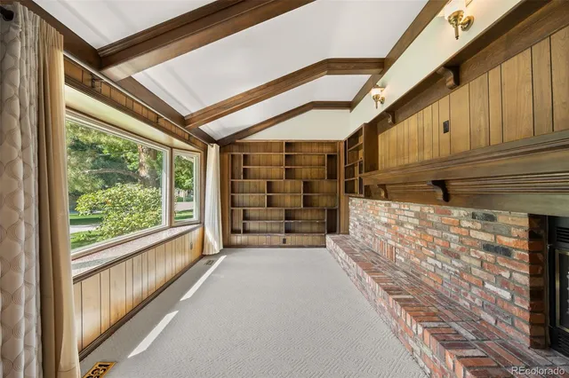 a view of an empty room with a balcony