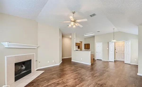 a view of a kitchen with a sink and a fireplace