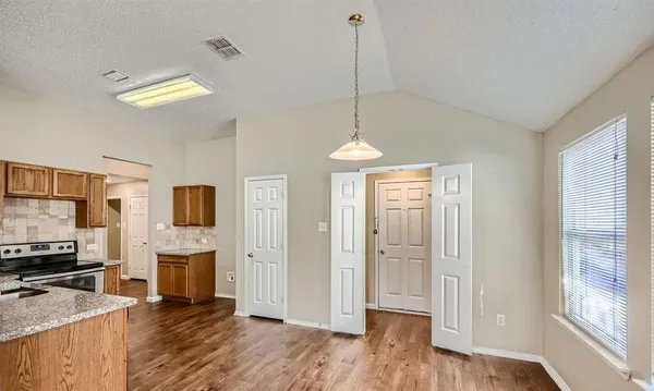 a view of a room with furniture a fireplace and wooden floor