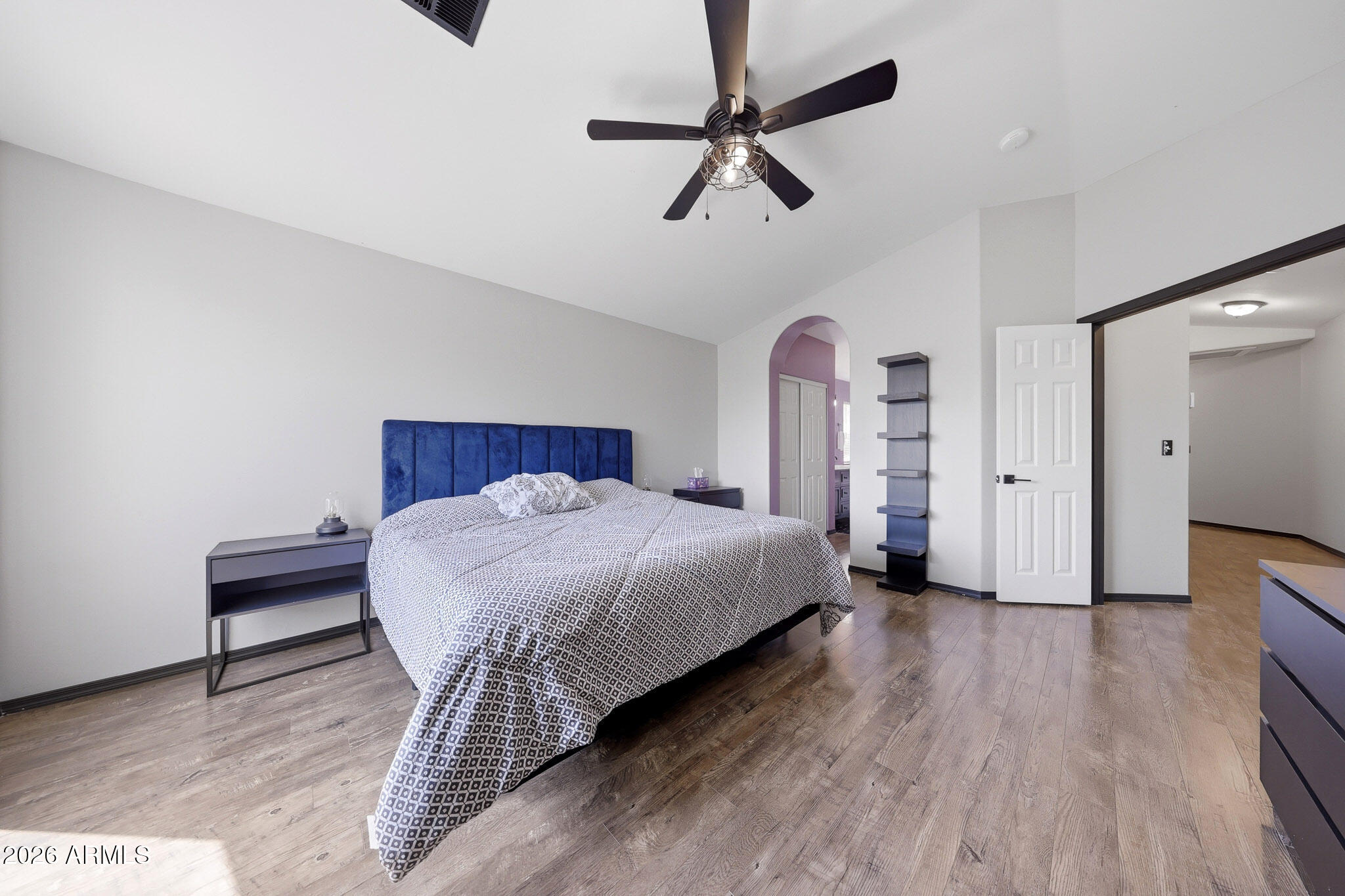 2167 East Nighthawk Way Phoenix, AZ 85048 - Photo 4 of 28 a spacious bedroom with a bed and a table