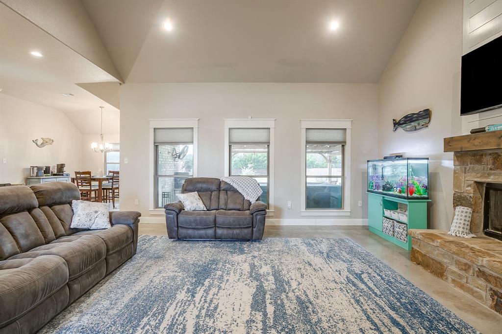111 Treys Way Godley, TX 76044 - Photo 11 of 38 a living room with fireplace furniture and a flat screen tv