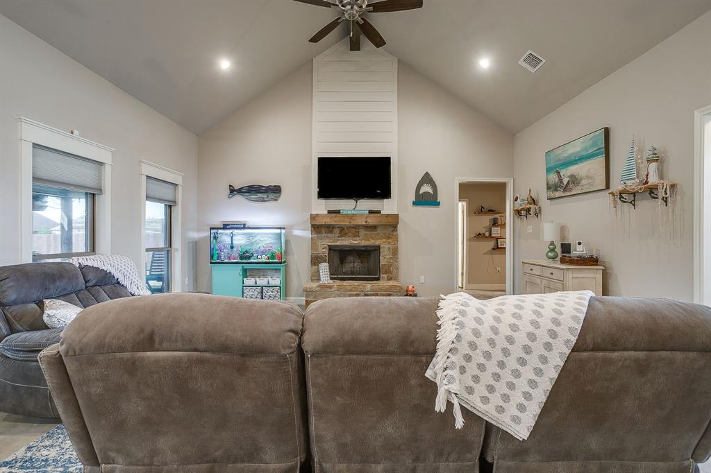 111 Treys Way Godley, TX 76044 - Photo 12 of 38 a living room with furniture and a flat screen tv