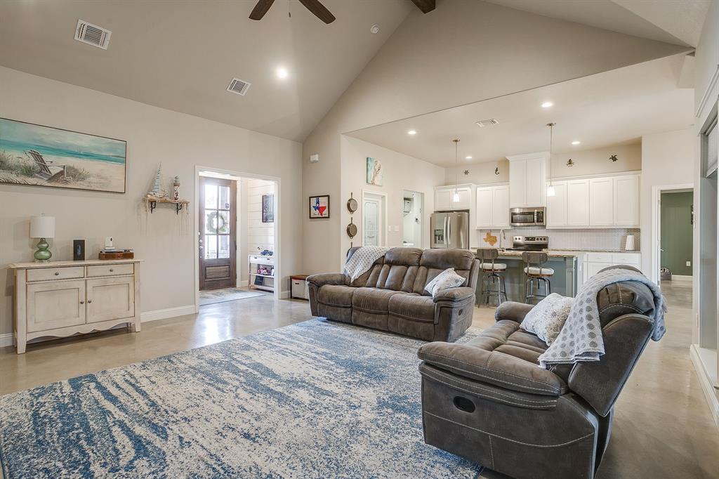 111 Treys Way Godley, TX 76044 - Photo 14 of 38 a living room with furniture and kitchen view