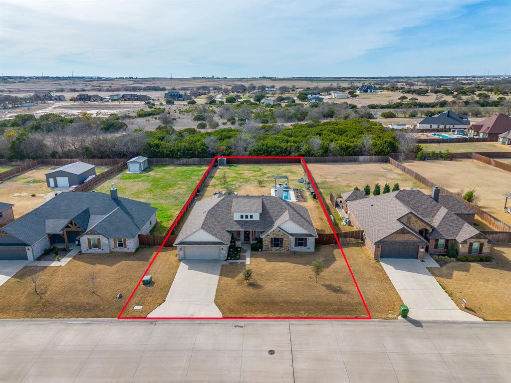 111 Treys Way Godley, TX 76044 - Photo 2 of 38 an aerial view of a house with a swimming pool