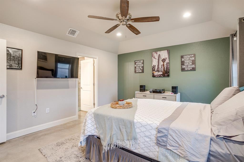 111 Treys Way Godley, TX 76044 - Photo 21 of 38 a bedroom with a bed and a flat screen tv