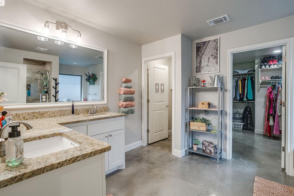 111 Treys Way Godley, TX 76044 - Photo 22 of 38 a bathroom with a sink double vanity and tub