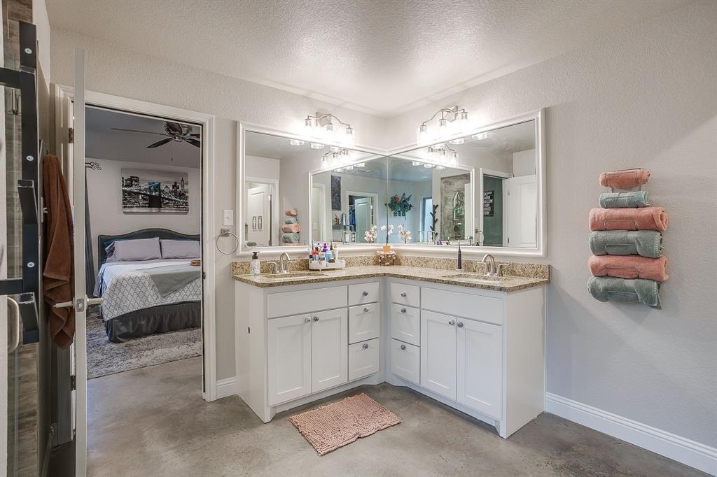111 Treys Way Godley, TX 76044 - Photo 23 of 38 a spacious bathroom with a double vanity sink and a mirror