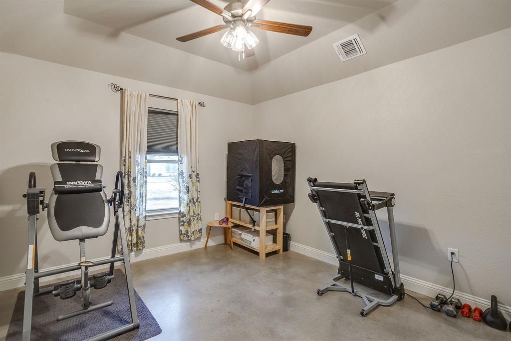 111 Treys Way Godley, TX 76044 - Photo 27 of 38 a view of a workspace with furniture and a gym