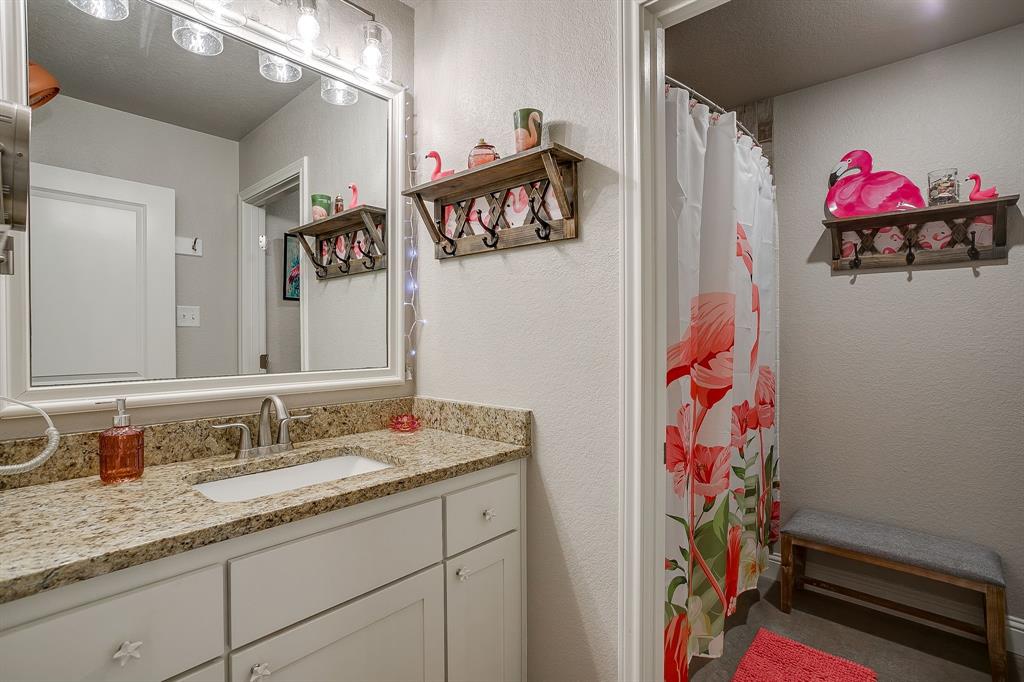 111 Treys Way Godley, TX 76044 - Photo 29 of 38 a bathroom with a sink vanity and a mirror