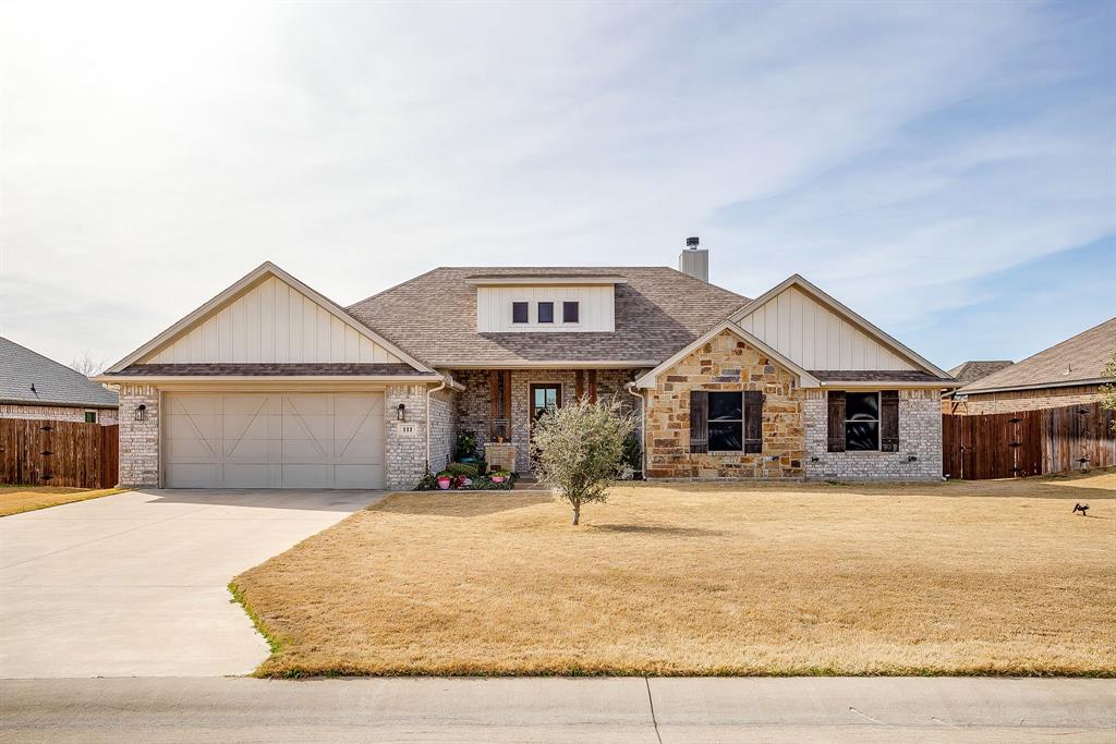 111 Treys Way Godley, TX 76044 - Photo 8 of 38 a front view of a house with yard and tress in the background
