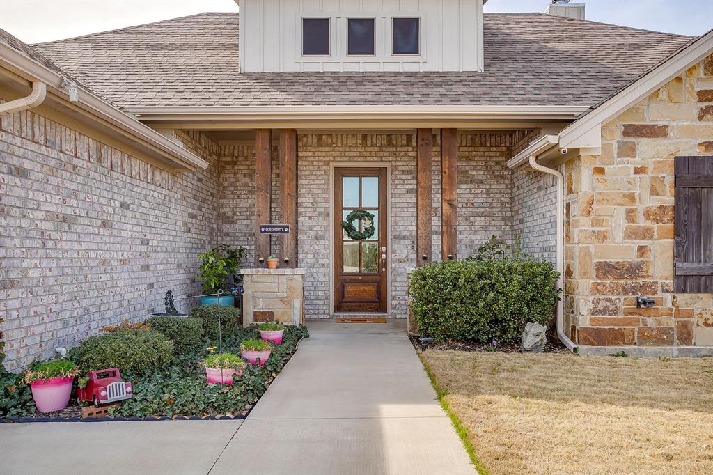 111 Treys Way Godley, TX 76044 - Photo 9 of 38 a front view of a house with a garden