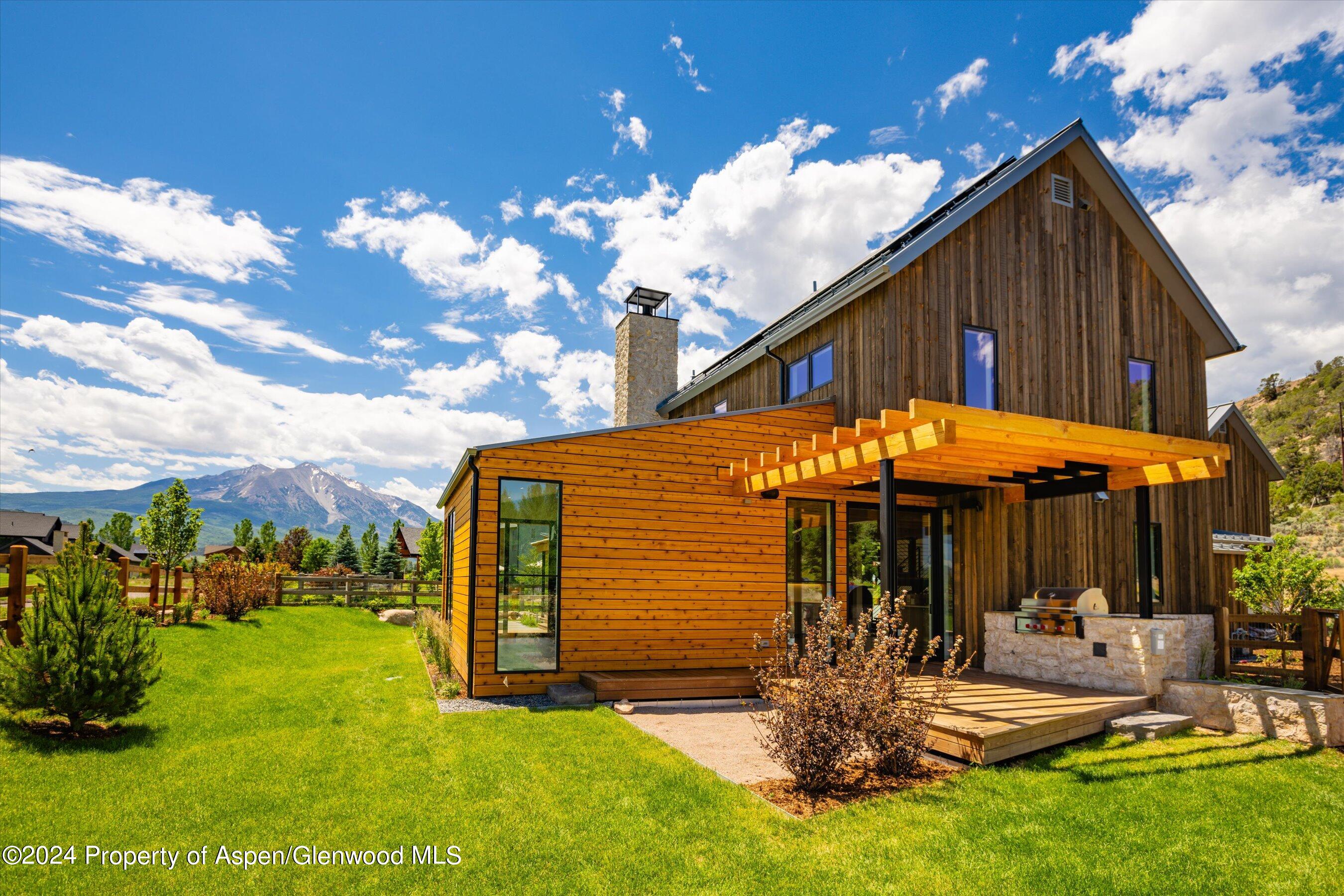 822 Perry Ridge Carbondale, CO 81623 - Photo 7 of 7 a view of a house with backyard porch and sitting area