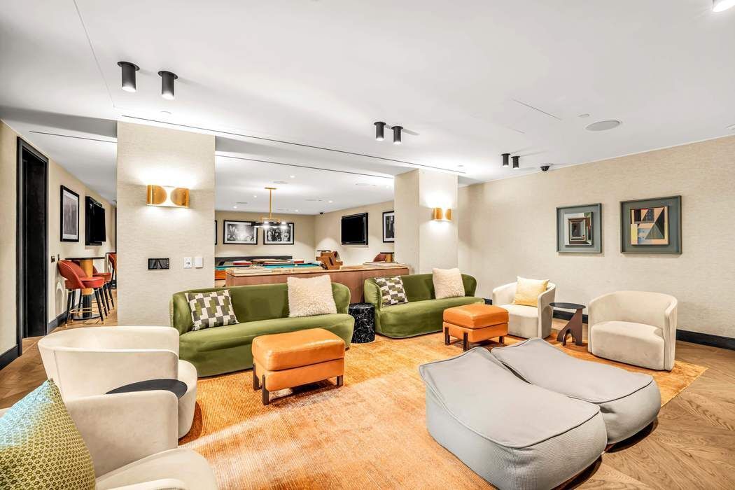 515 West 18th Street, Unit 308 Manhattan, NY 10011 - Photo 12 of 16 a living room with furniture and a view of bedroom