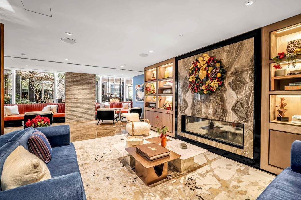 515 West 18th Street, Unit 308 Manhattan, NY 10011 - Photo 14 of 16 a living room with furniture and a large window