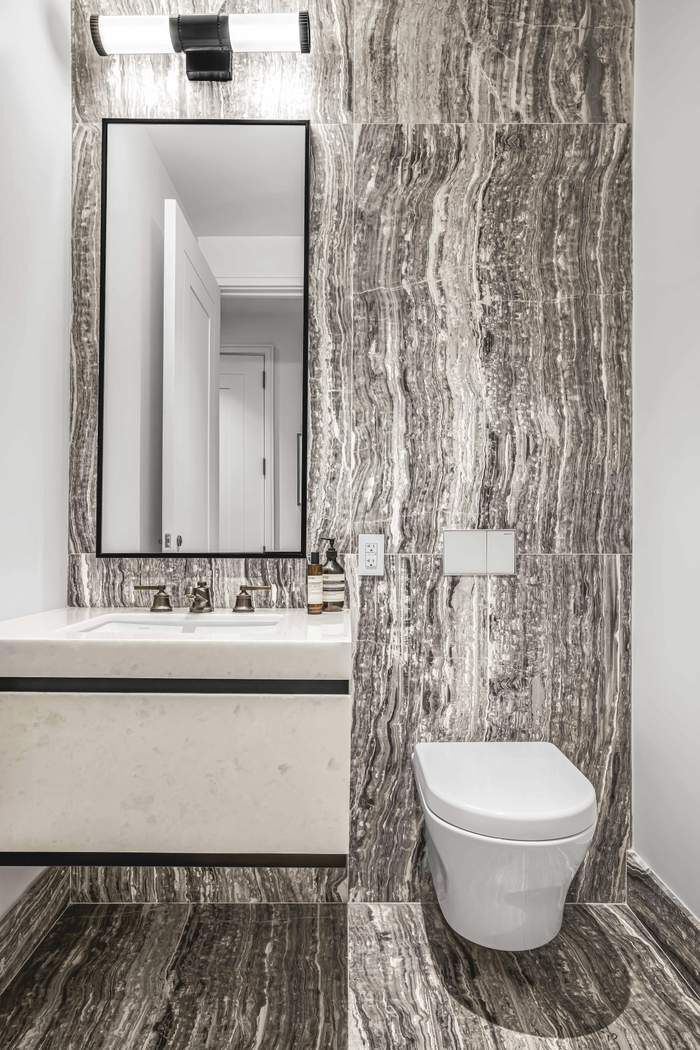 515 West 18th Street, Unit 308 Manhattan, NY 10011 - Photo 8 of 16 a bathroom with a toilet sink and mirror