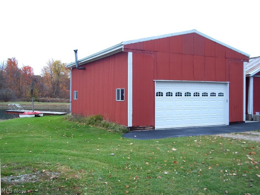 5650 Leroy Road Wakeman, OH 44889 - Photo 21 of 25 24 x 32 pole barn with loft, newer overhead door and opener, slab floor, 220-line and wood burner