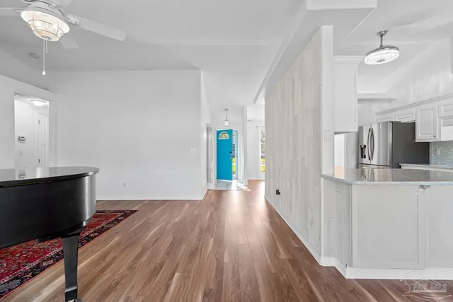 a view of an empty room with a window