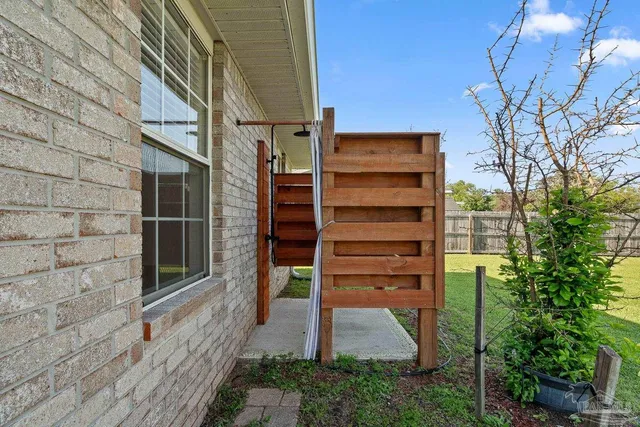 a view of a wooden door and a window