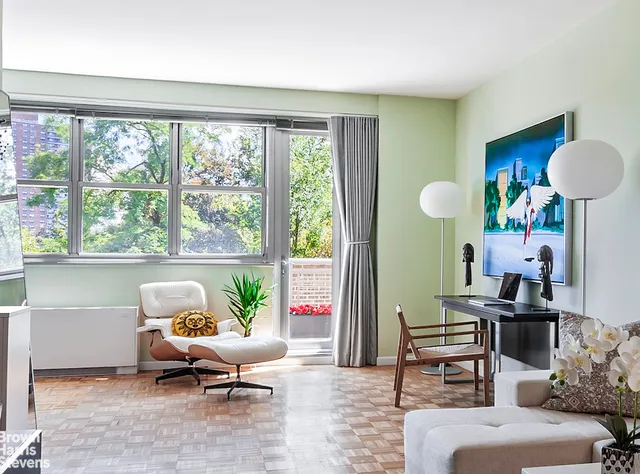 a living room with furniture and a window