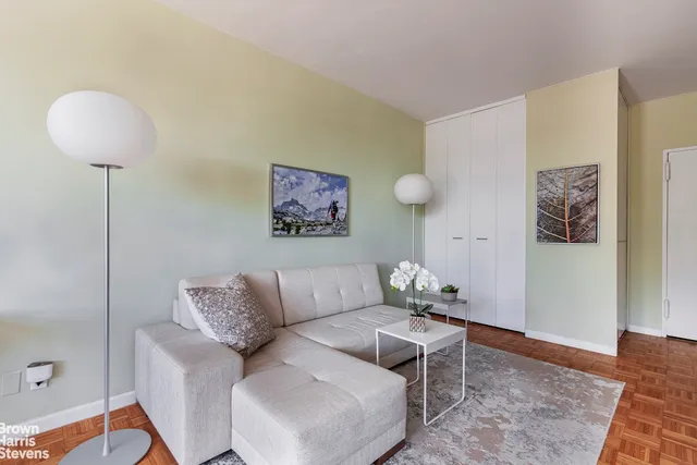 a view of city from balcony with outdoor seating