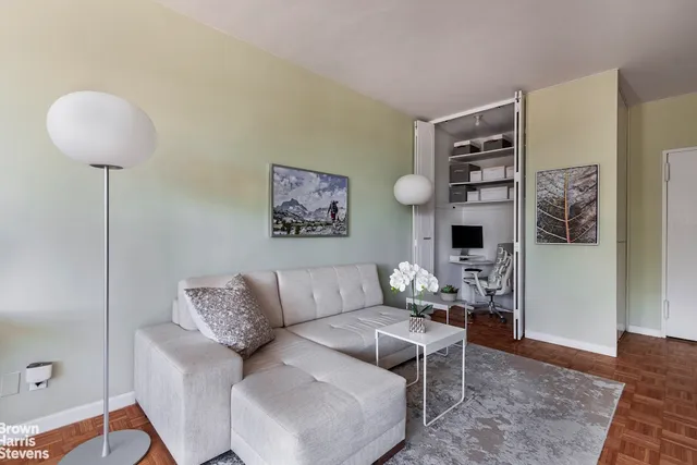 a living room with furniture and a rug