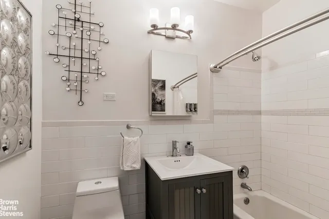 a kitchen with stainless steel appliances granite countertop a stove and a microwave