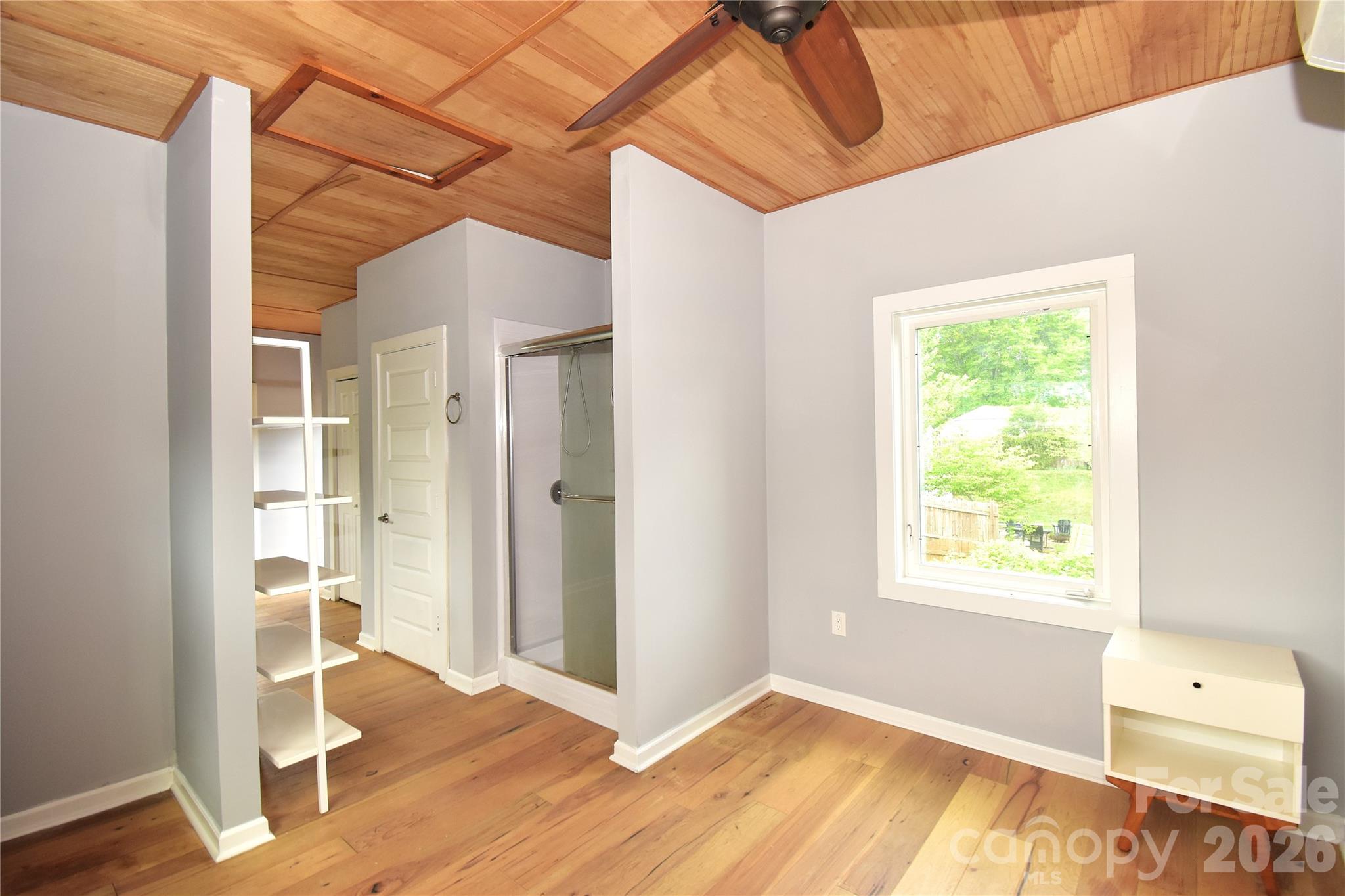 6 Belvedere Road Asheville, NC 28803 - Photo 29 of 33 a view of an empty room with wooden floor and a window
