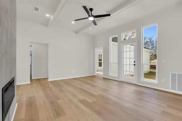 a kitchen with stainless steel appliances a refrigerator sink and microwave