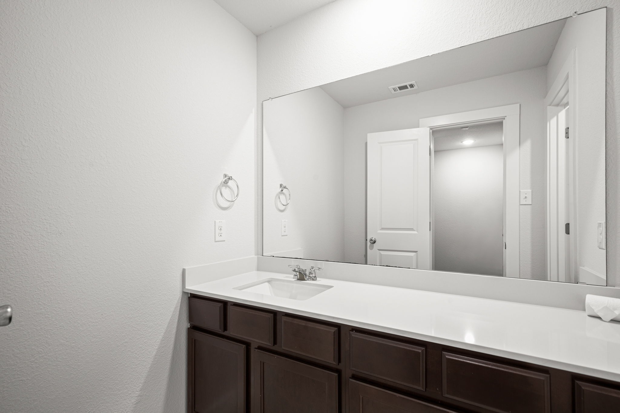 841 Spinnaker Loop Kyle, TX 78640 - Photo 34 of 40 Bathroom with vanity and a textured wall