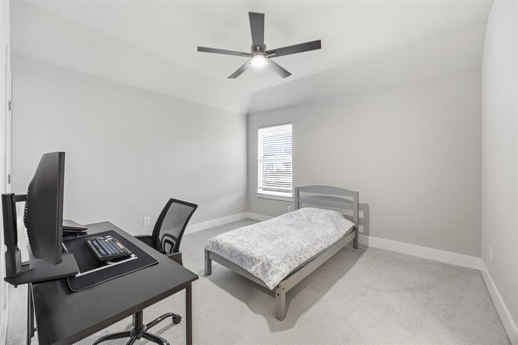 5805 Heatherwood Loop Sachse, TX 75048 - Photo 30 of 39 a bedroom with a bed and a window