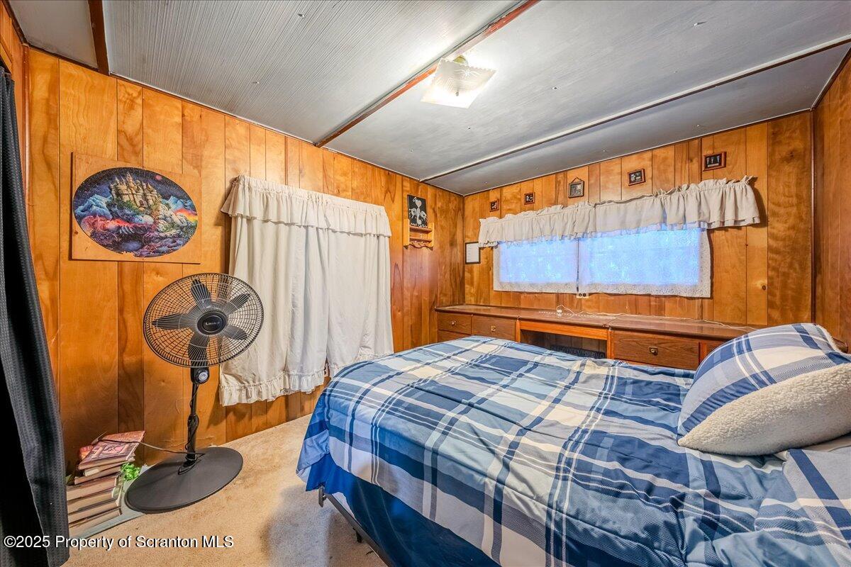 2099 Turnpike Road Dalton, PA 18414 - Photo 11 of 16 a bedroom with a bed and a table in it