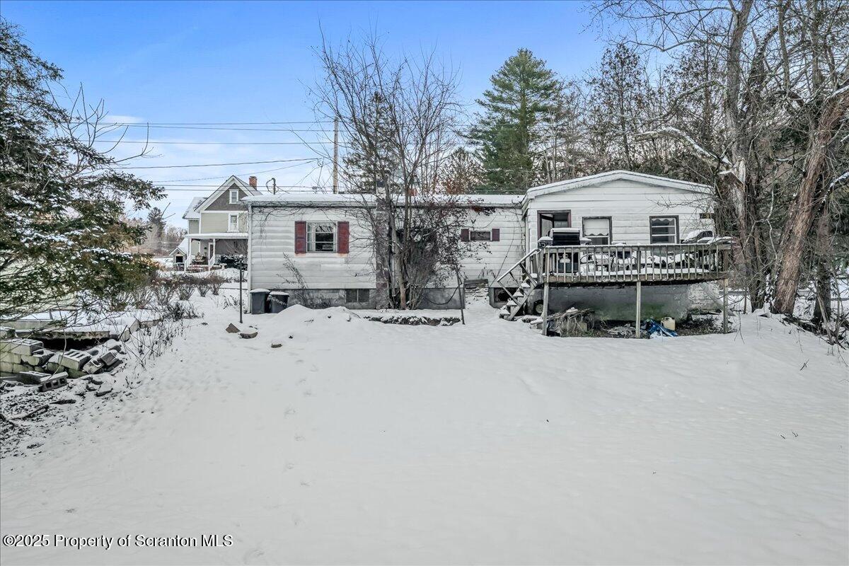 2099 Turnpike Road Dalton, PA 18414 - Photo 14 of 16 a view of a house with a snow in the background