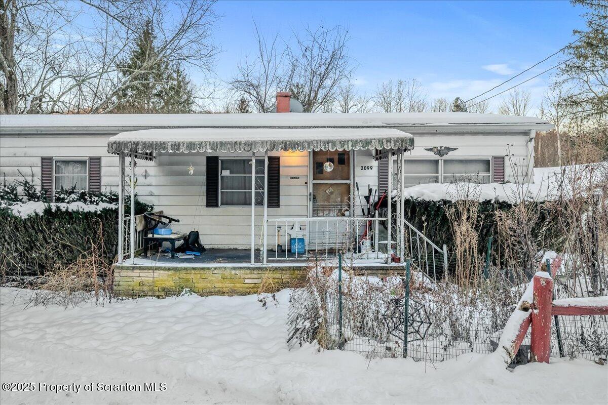2099 Turnpike Road Dalton, PA 18414 - Photo 15 of 16 a view of a house with outdoor seating area
