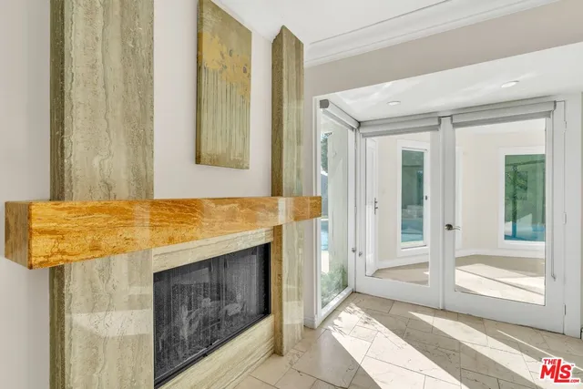 a kitchen with stainless steel appliances granite countertop a sink and a window