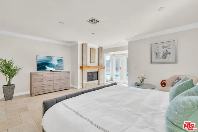 a bedroom with a bed and a night stand