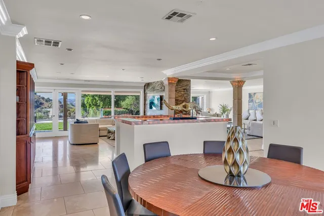 a kitchen with a table and chairs