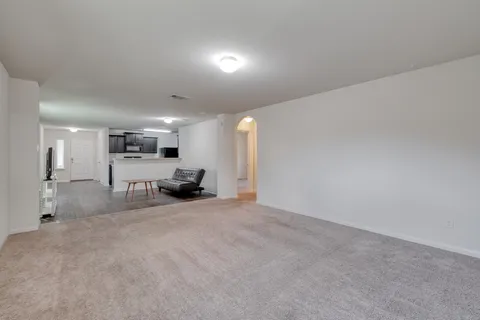 a view of a livingroom with furniture and a table