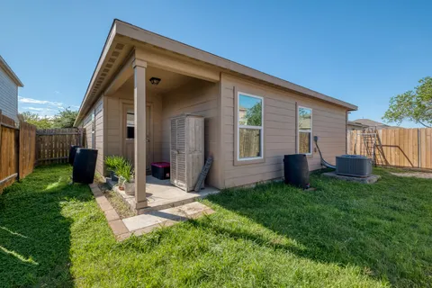 a view of an house with backyard space and garden