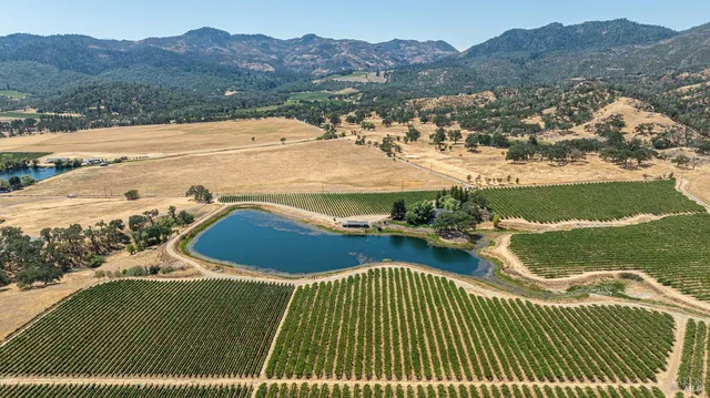 a view of a balcony with a yard