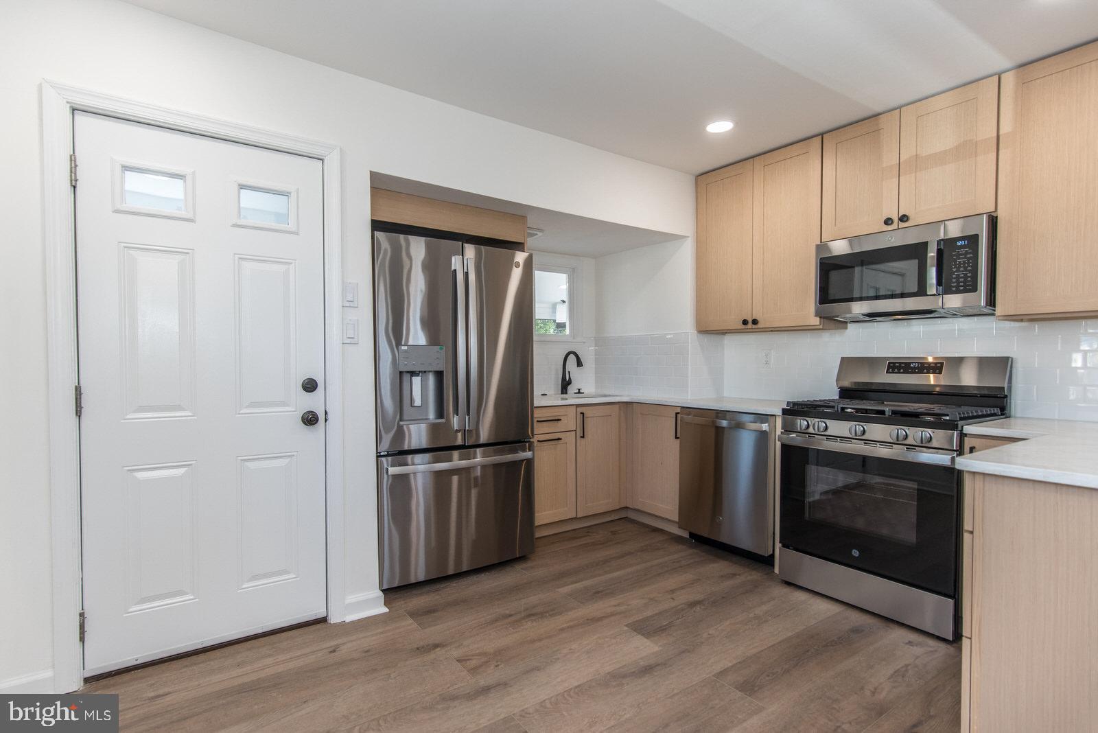17 Rhode Island Avenue Cherry Hill, NJ 08002 - Photo 18 of 86 a kitchen with stainless steel appliances granite countertop a refrigerator microwave and sink
