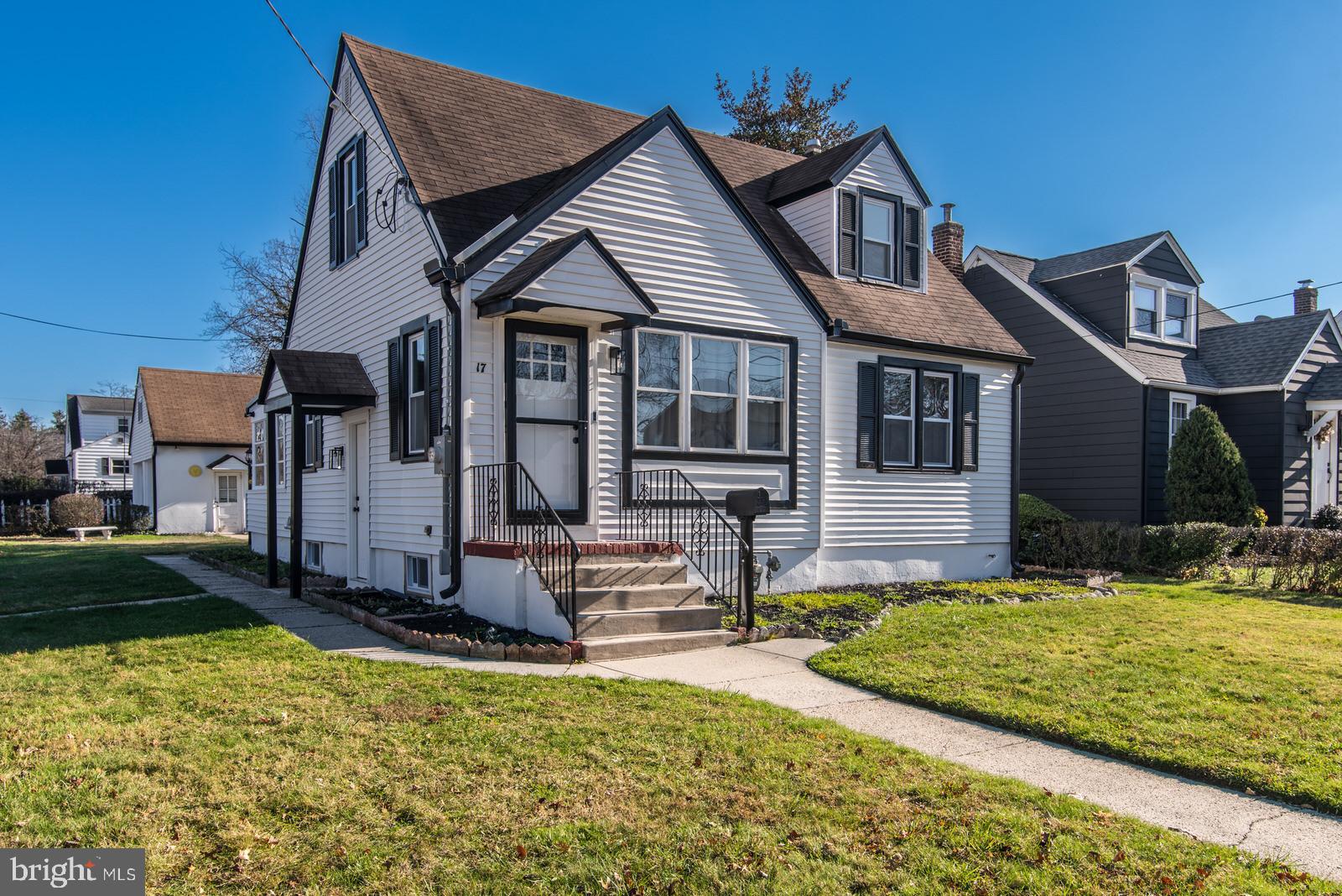 17 Rhode Island Avenue Cherry Hill, NJ 08002 - Photo 2 of 86 a front view of a house with a yard