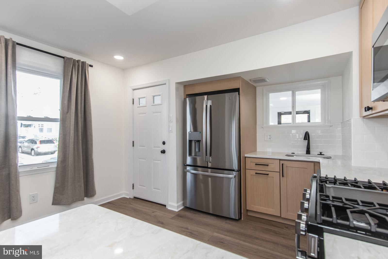 17 Rhode Island Avenue Cherry Hill, NJ 08002 - Photo 22 of 86 a kitchen with a refrigerator and a stove top oven