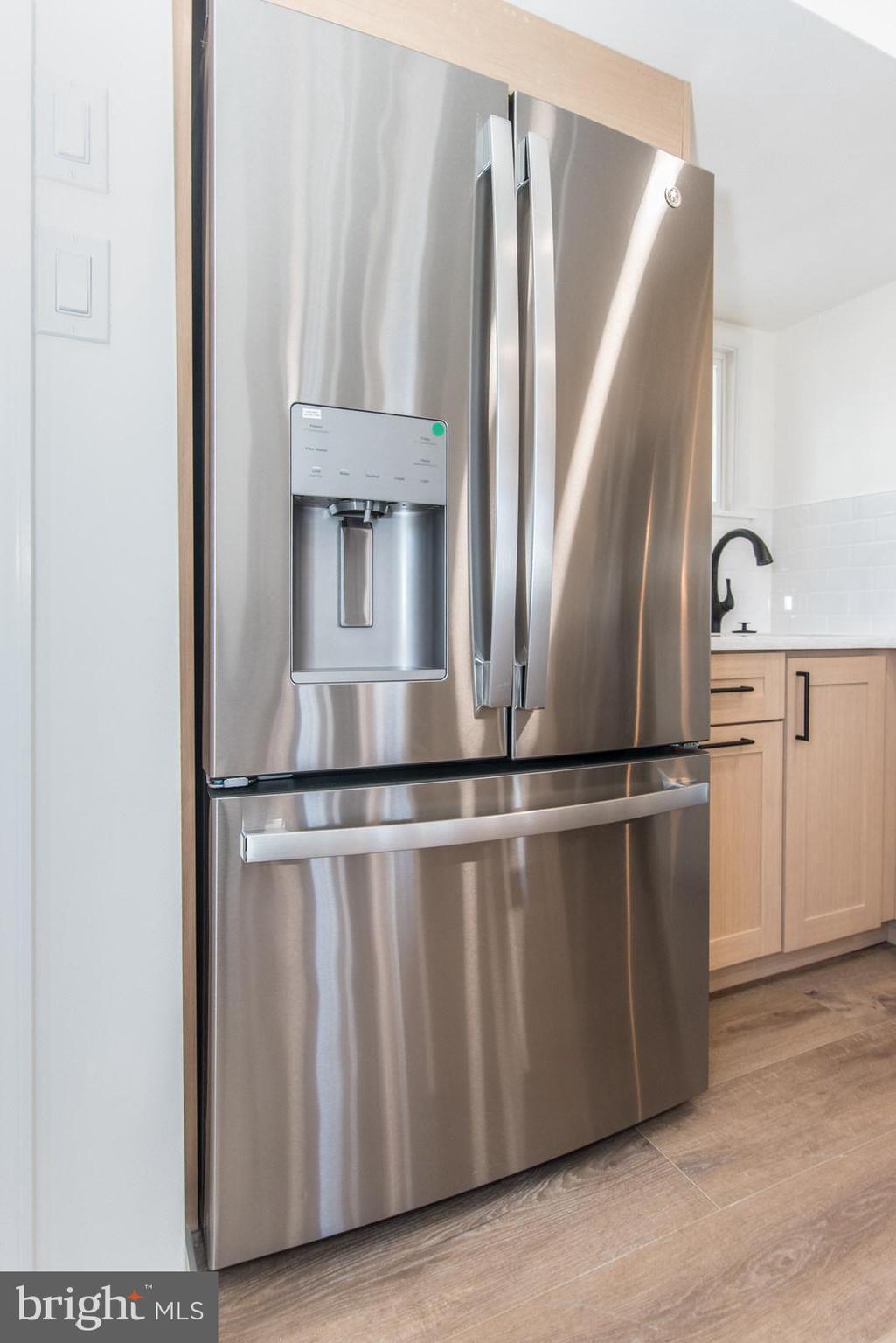 17 Rhode Island Avenue Cherry Hill, NJ 08002 - Photo 23 of 86 a close view of a refrigerator a sink and dishwasher with wooden floor