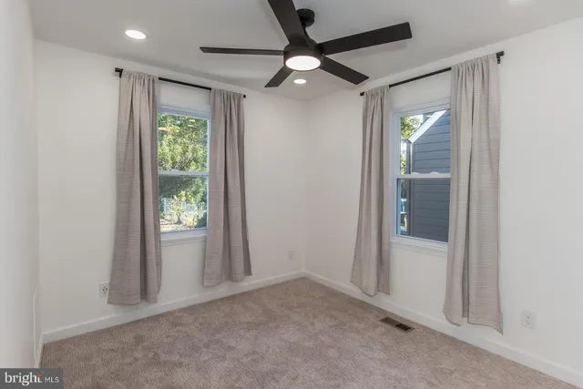 a view of a hallway with white walls