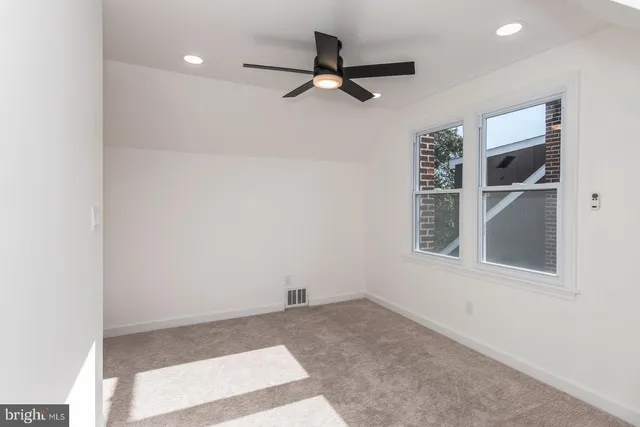 a view of a house with backyard tub and sitting area