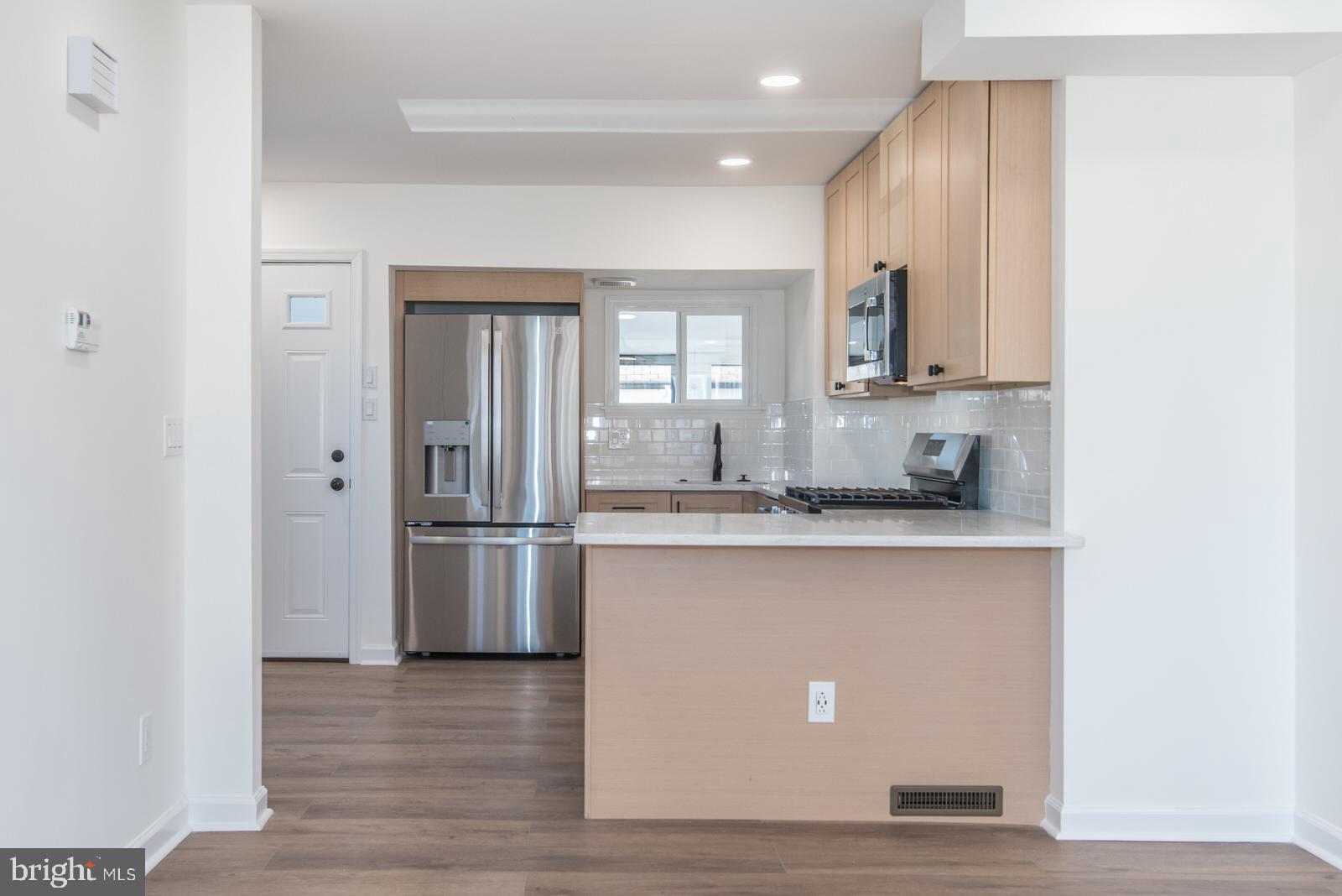17 Rhode Island Avenue Cherry Hill, NJ 08002 - Photo 10 of 86 a kitchen with stainless steel appliances granite countertop a stove a sink and a refrigerator