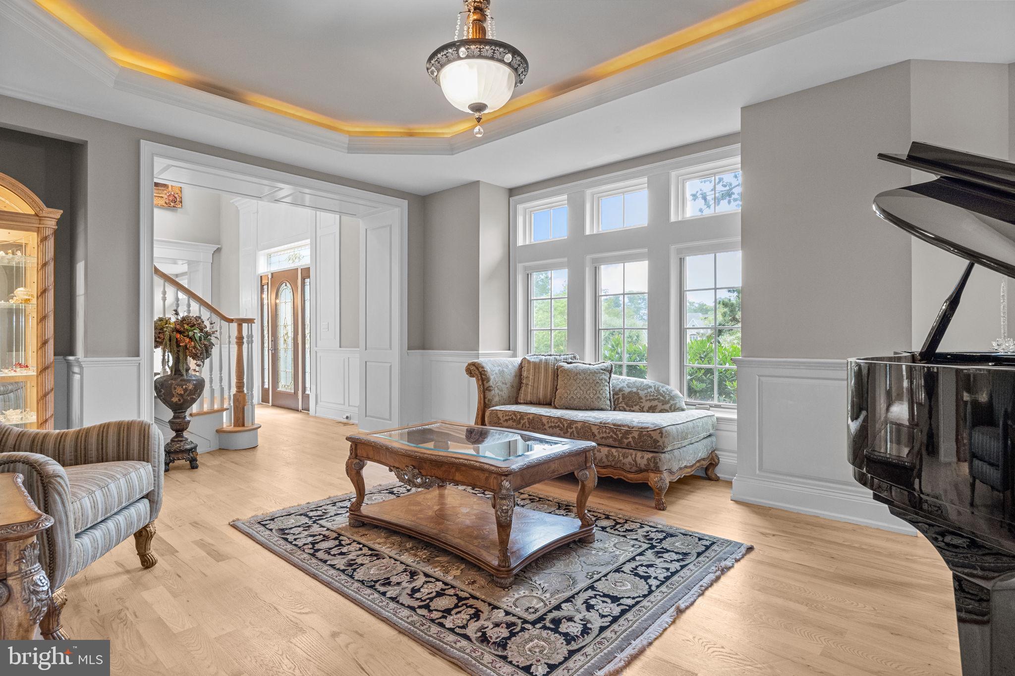 2 Aldans Way Newtown, PA 18940 - Photo 12 of 100 a living room with furniture a rug and a floor to ceiling window