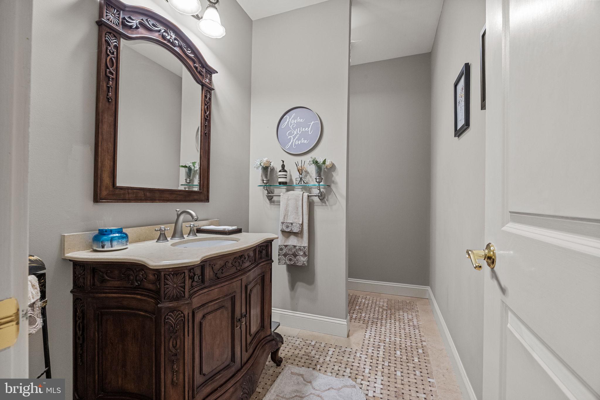 2 Aldans Way Newtown, PA 18940 - Photo 16 of 100 a bathroom with a sink a mirror and a toilet