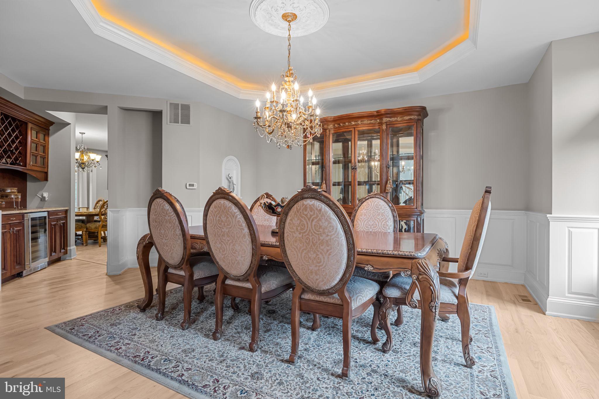 2 Aldans Way Newtown, PA 18940 - Photo 31 of 100 a view of a dining room with furniture a chandelier and wooden floor