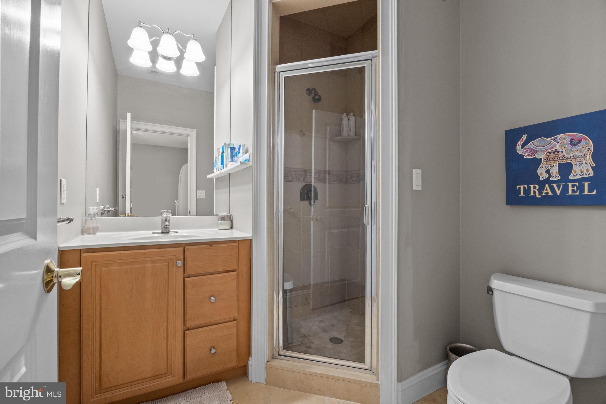 2 Aldans Way Newtown, PA 18940 - Photo 41 of 100 a bathroom with a toilet a sink and glass door